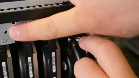 Adjusting hard disc drive to computer case Stock Footage 124741591