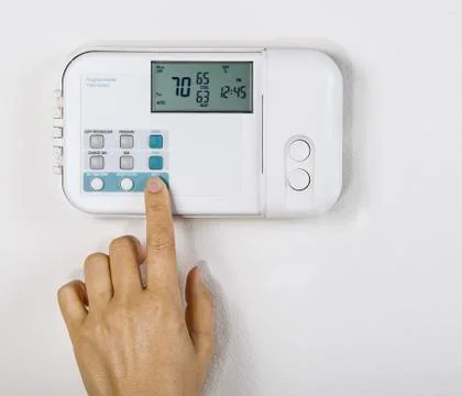 Adjusting home temperature Foto stock