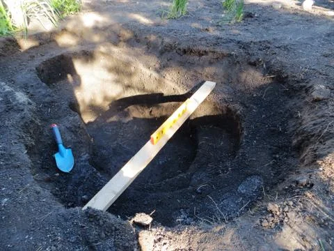 Adjusting horizontal plane with a bubble level and trowel Stock Photos