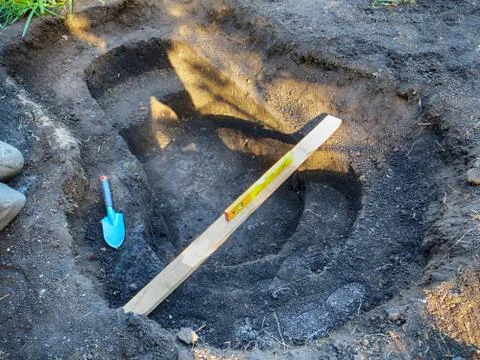 Adjusting horizontal plane with a bubble level and trowel Stock Photos