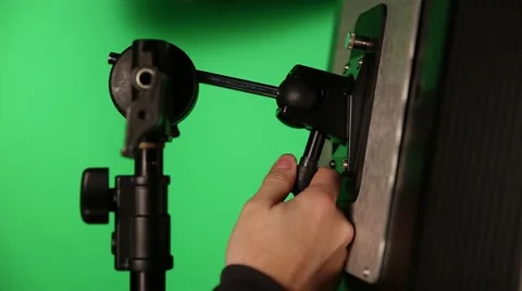 Adjusting a KinoFlo Light Stock Footage 45880791