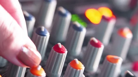 Adjusting knobs on audio mixer in home recording studio during podcast Video stock 142070046