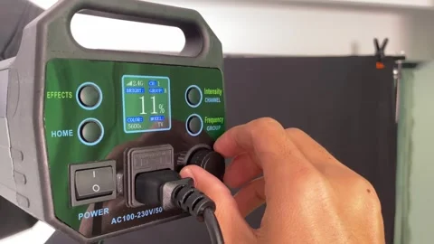 Adjusting light control panel power. Professional photography lighting studio Stock Footage 247688422