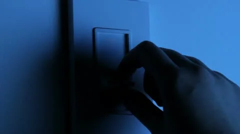 Adjusting light with dimmer switch Stock Footage
