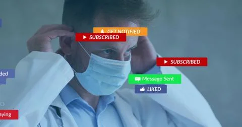 Adjusting male doc pulling surgical mask ear loops in clinic, lab coat, Stock Photos