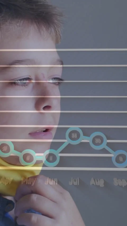Adjusting mask, boy with animation of data graph overlay showing monthly trends Stock Footage 344370353