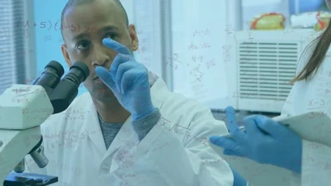 Adjusting microscope man examining sample to report, labcoats, blue gloves, peer Stock Footage 331712807