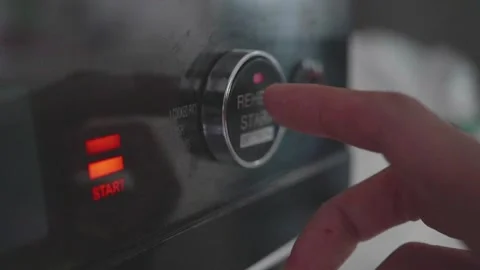 Adjusting Microwave Settings for Perfect Cooking Stock Footage 313829993