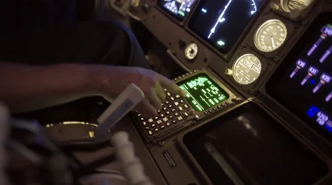 Adjusting navigation controls in 747 jet cockpit 4K Stock Footage 53128574