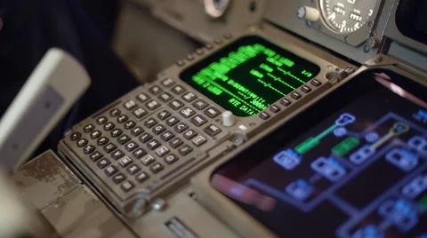 Adjusting navigation controls in commercial jet cockpit 4K Stock Footage 53128832