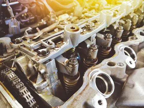 Adjusting nuts and valve spring of the car engine valve Stock Photos