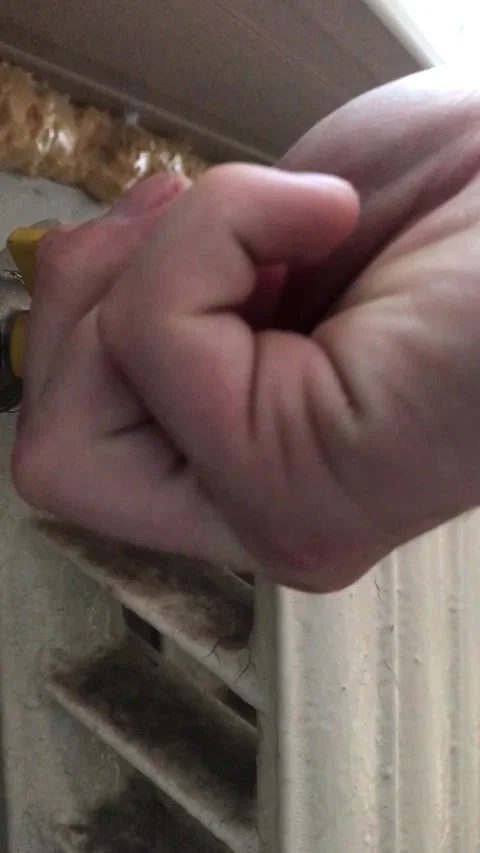 Adjusting radiator valve for optimal heating in room Stock Footage 308368289