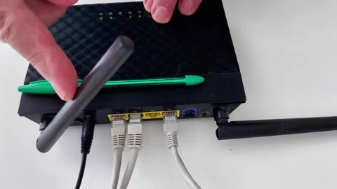Adjusting Router Antenna and Cables for Network Connectivity 動画素材 330631860