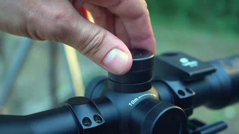 Adjusting the scope for hunting. Stock Footage 344438220