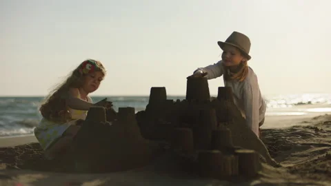 Adjusting shape of tower on sandcastle 스톡 동영상 155893254