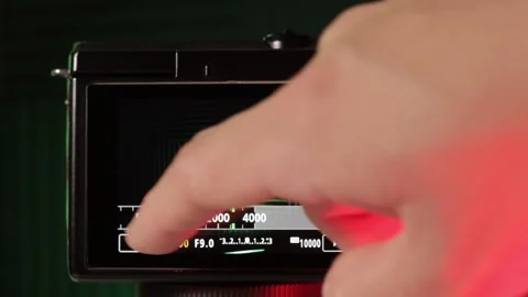 Adjusting the shutter speed of a professional mirrorless camera, very Stock Footage 246349391