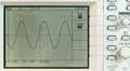 Adjusting sine wave on oscilloscope HD Footage