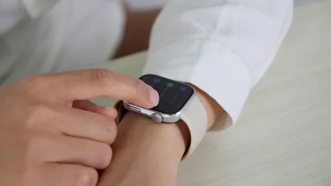 Adjusting Smartwatch Strap on Wrist in Close Up Vídeo Stock 347626555