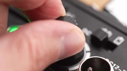 Adjusting the Switch on Electronic Device. Stock Footage 256236546
