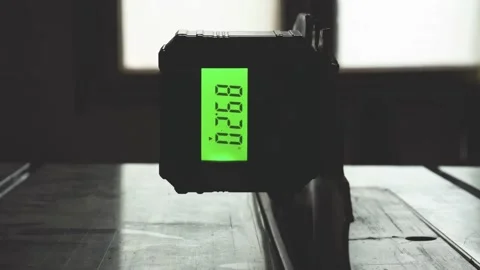 Adjusting table wood saw blade angle using a digital angle finder gauge Video stock 249933193