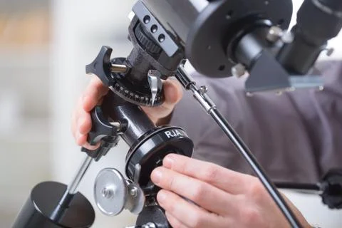 Adjusting telescope Stock Photos