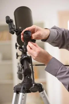 Adjusting telescope Stock Photos