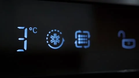 Adjusting temperature of refrigerator on kitchen 库存影片 250796271