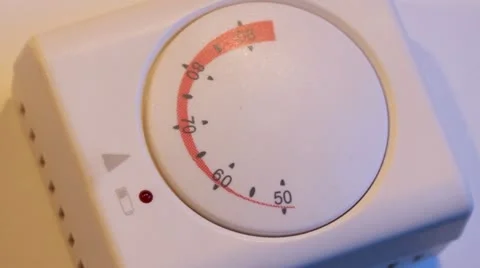 Adjusting Thermostat Stock Footage 21943494