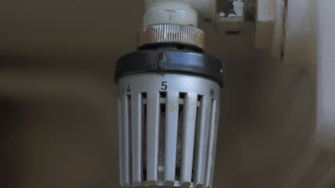Adjusting thermostat on the radiator Video stock 88211267