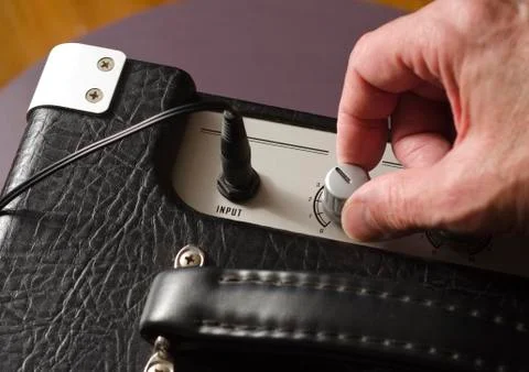 Adjusting volume on amplifier Stock Photos