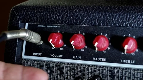 Adjusting the volume on a guitar amplifier Stock Footage 46831937