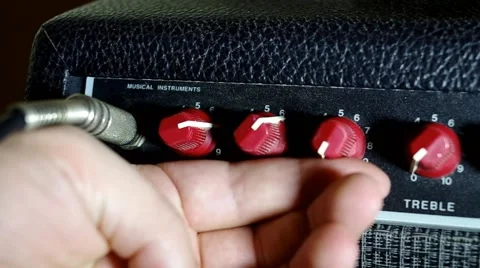 Adjusting the volume on a guitar amplifier Stock Footage 46832014