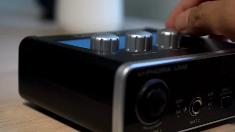 Adjusting the volume knob for audio interface Stock-Footage 102498813
