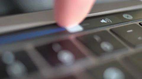 Adjusting Volume on Laptop Touch Panel Slider Video stock 145112853