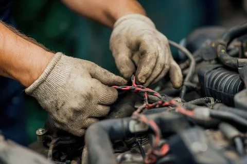 Adjusting wires in workshop 스톡 사진