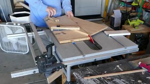 Adjusting Wood on a Table Saw Sled Before Cutting Stock Footage 336552783