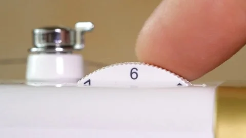 Adjustment of the upper thread tension regulator in the sewing machine Stock Footage 82280738
