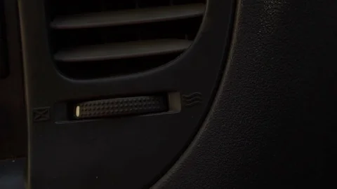 Adjustment of the ventilation system in the car. close-up. Slow motion Stock-Footage 80058668