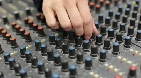 Adjusts the sound to mixer Stock Footage 64258644