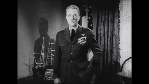 Adm. Byrd speaks and points to a map of Antarctica - 1933-36