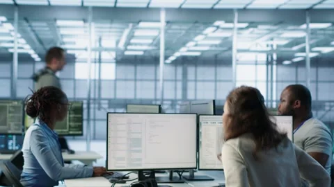 Admin arriving in server hub, sitting at computer desk, Stock Footage 319247964
