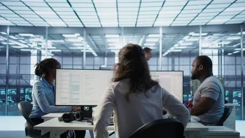 Admin arriving in server hub, sitting at computer desk, Stock Footage 319252960
