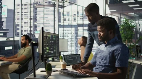 Admin assisted by coworker while working with machine learning Stock Footage 318240398