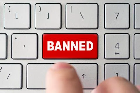 Admin bans the user. red button on the keyboard of a notebook with the inscri Foto stock
