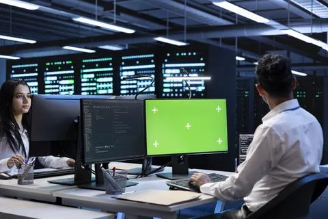 Admin coworkers using mockup computer monitor to check server clusters Stock Photos