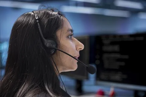 Admin in data center facility managing call center tasks 写真素材