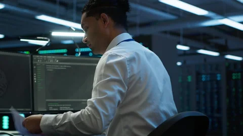Admin in data center maintaining accurate documentation of infrastructure Stock Footage 280716384