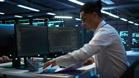 Admin in data center maintaining accurate documentation of infrastructure Stock Footage 280803276