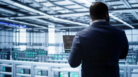 Admin in data center running error checking utilities on tablet to fix hardware Stock Footage 277654066