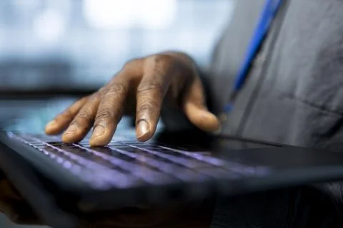 Admin in data center typing on notebook keyboard, using automation tools Foto stock